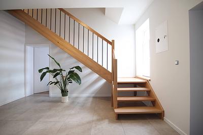 Hall with wooden stairs in the Hajduczek farm stay house