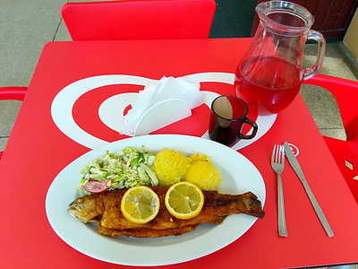 Canteen lunch: fried fish with potatoes and salad